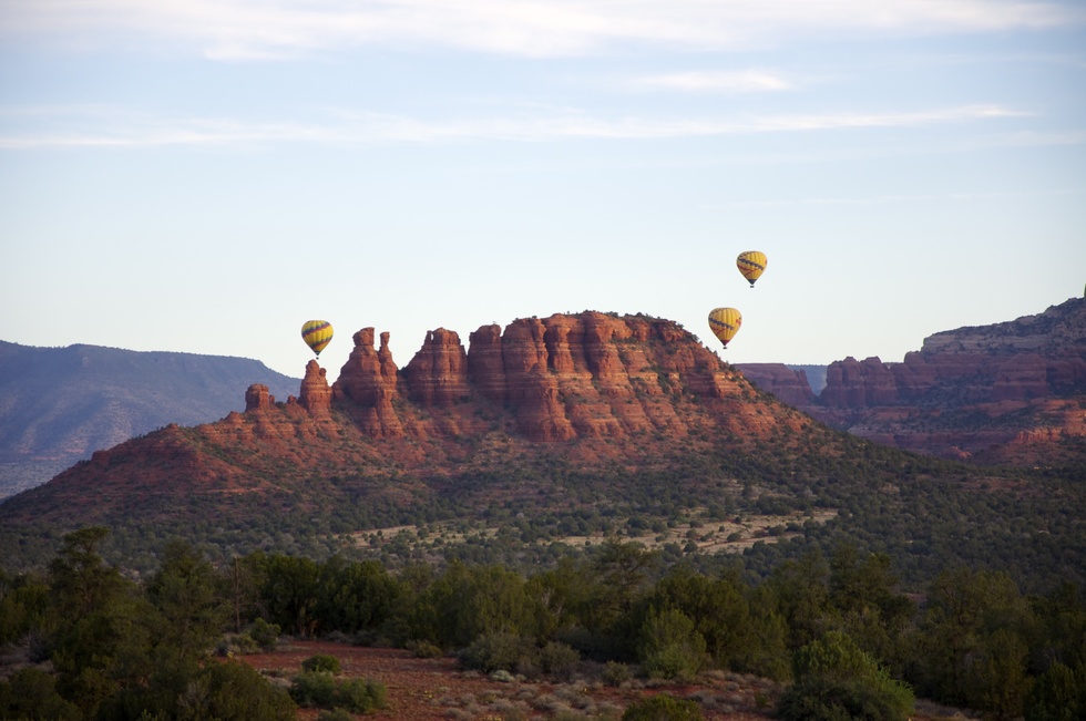 Balloon riders take in the majestic rock formations of Sedona, Arizona