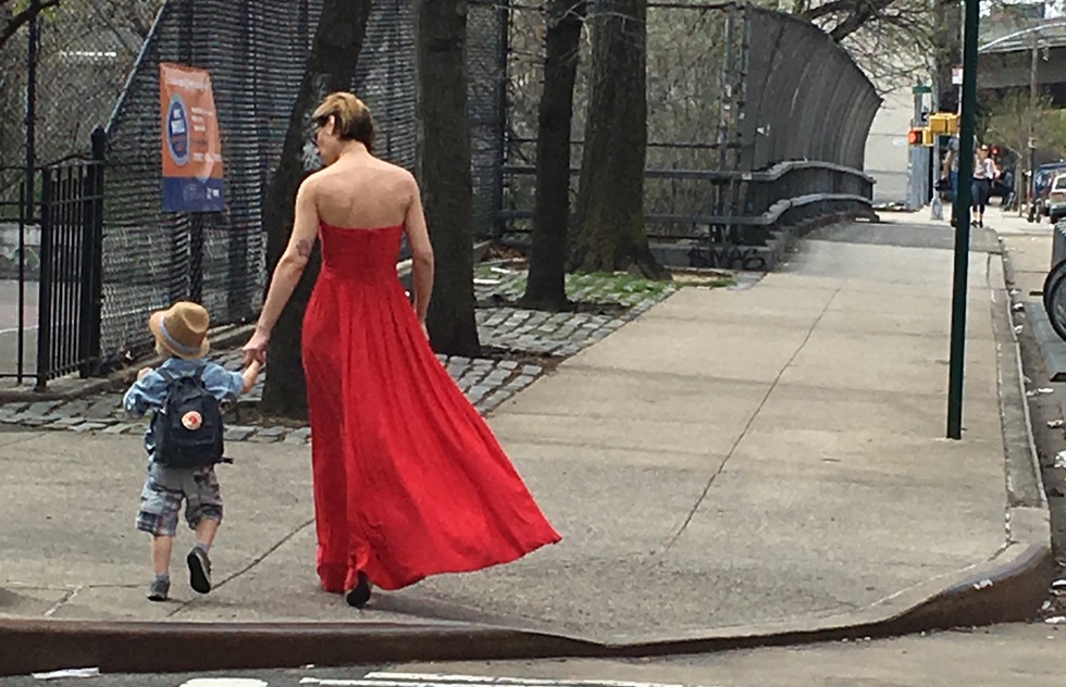 A mother and son walk through Williamsburg, Brooklyn
