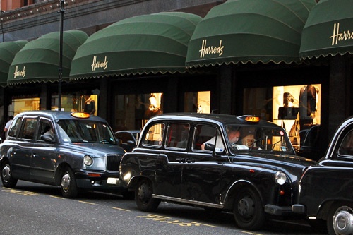 London cabs waiting outside the Harrods department store.