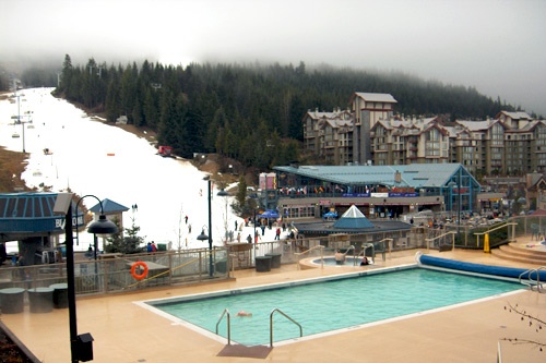 Pool and ski slopes at the Pan Pacific Whistler Mountainside in Whistler, British Columbia.