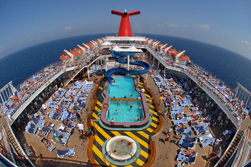Guests aboard Carnival Cruise Lines' Sensation enjoy the pools, whirlpools and deck lounges on Lido Deck. Photo: Carnival Cruise Lines
